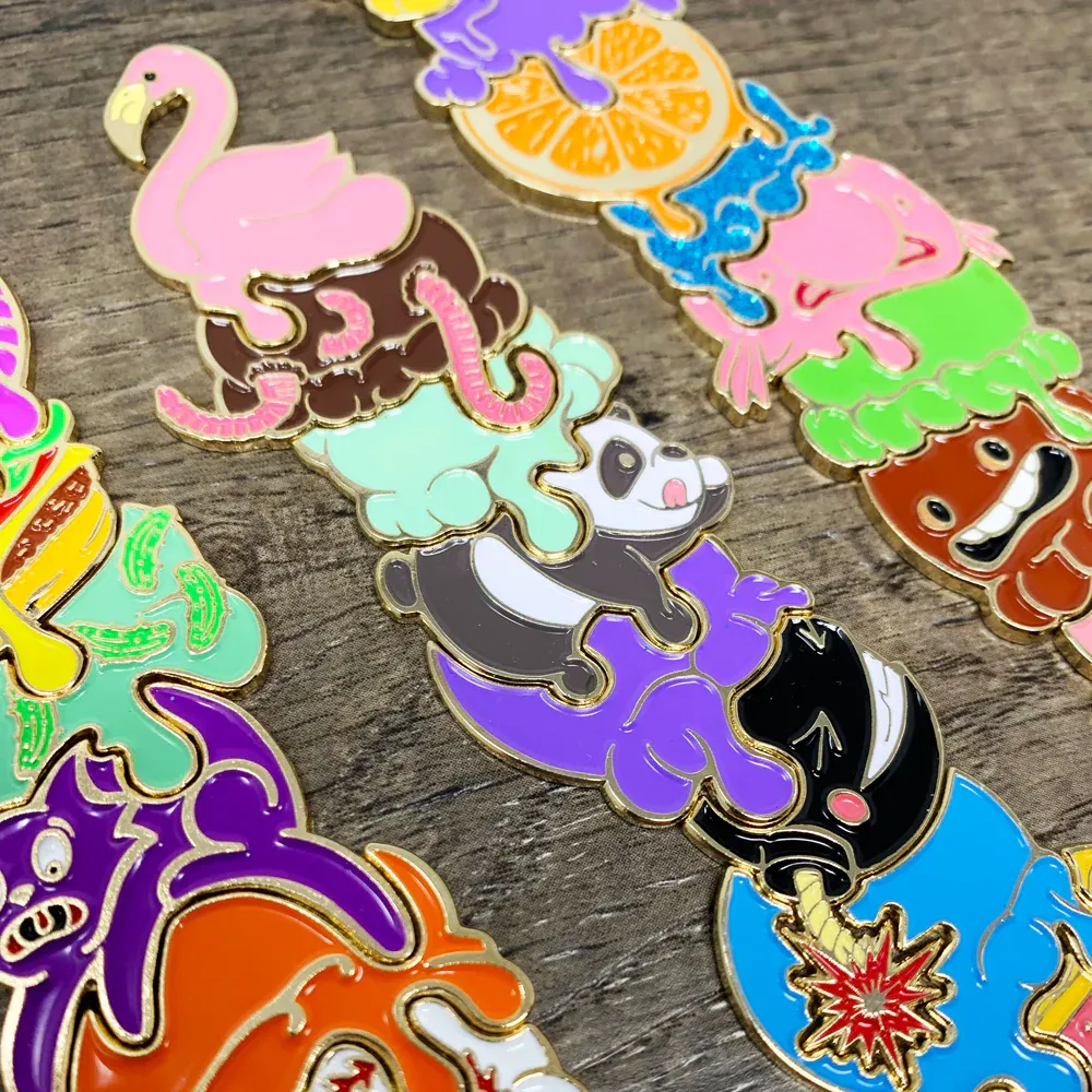 Metal and enamel jigsaw pieces form three ice cream cones stacked with unusual ingredients such as a panda