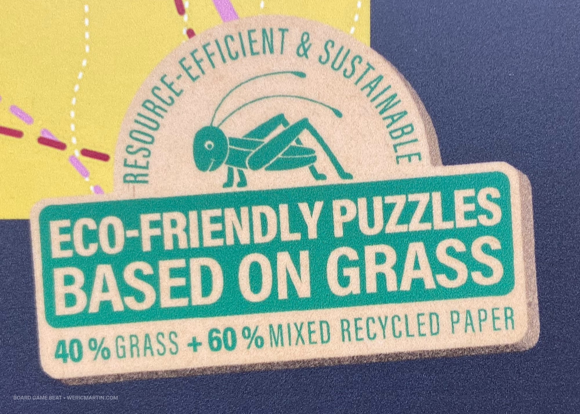A logo reading "Eco-friendly puzzles based on grass" and "40% grass + 60% mixed recycled paper"