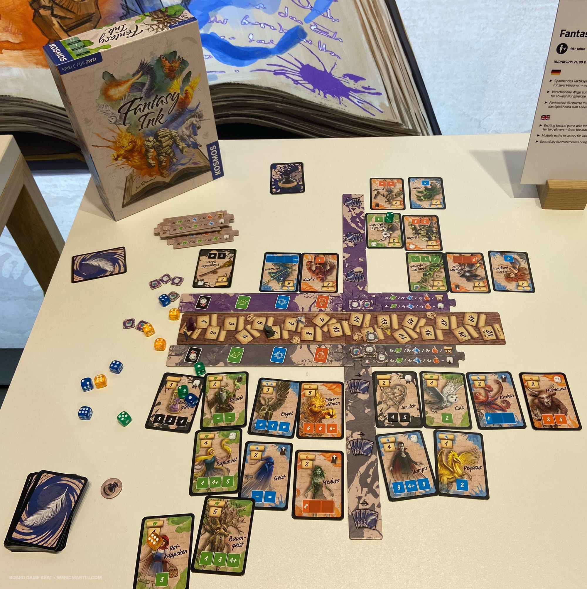 A display of cards, with each player having their own collection, somewhat divided by color