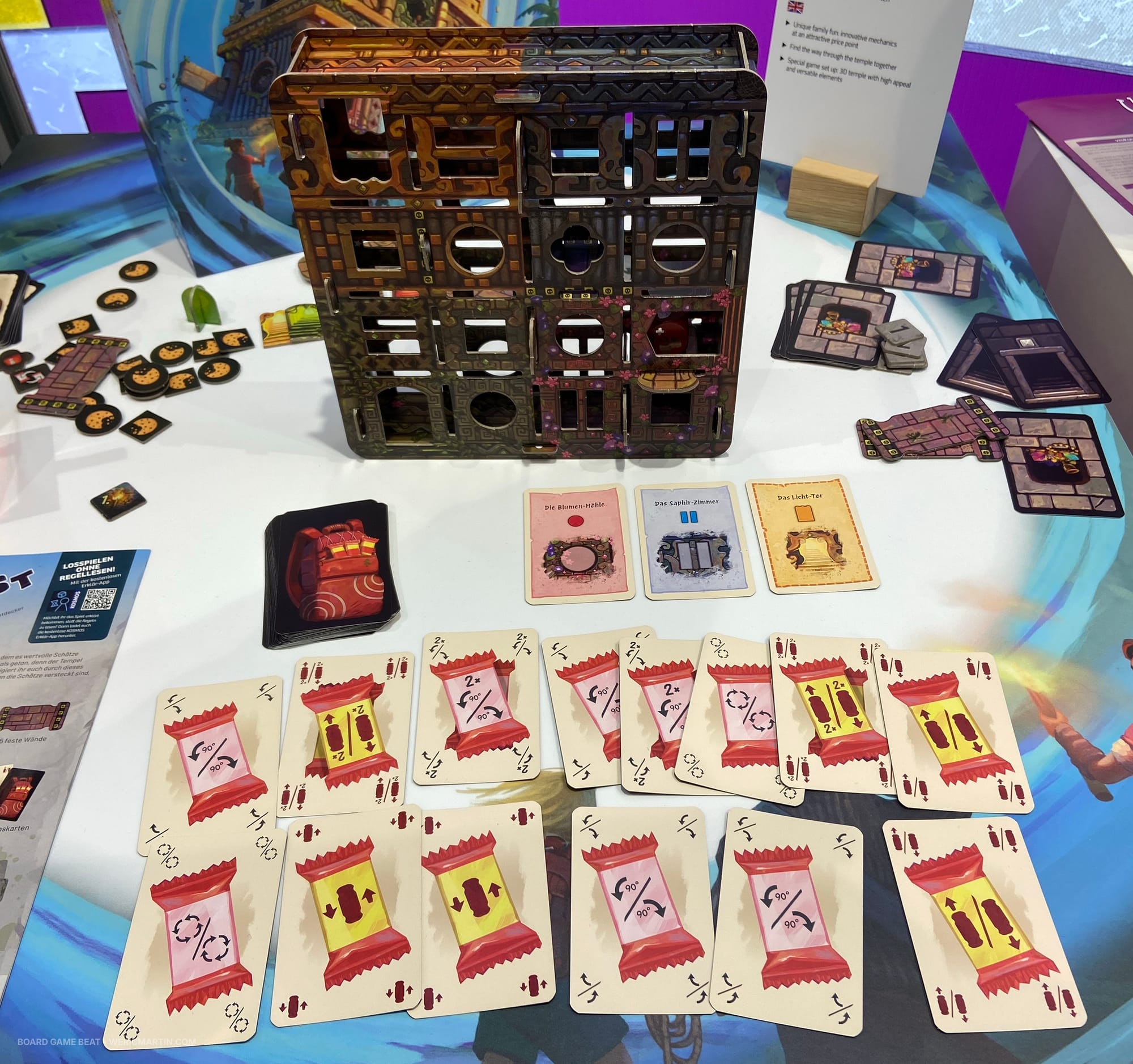 The vertical game board for Temple Twist is accompanied by different card types and other game components