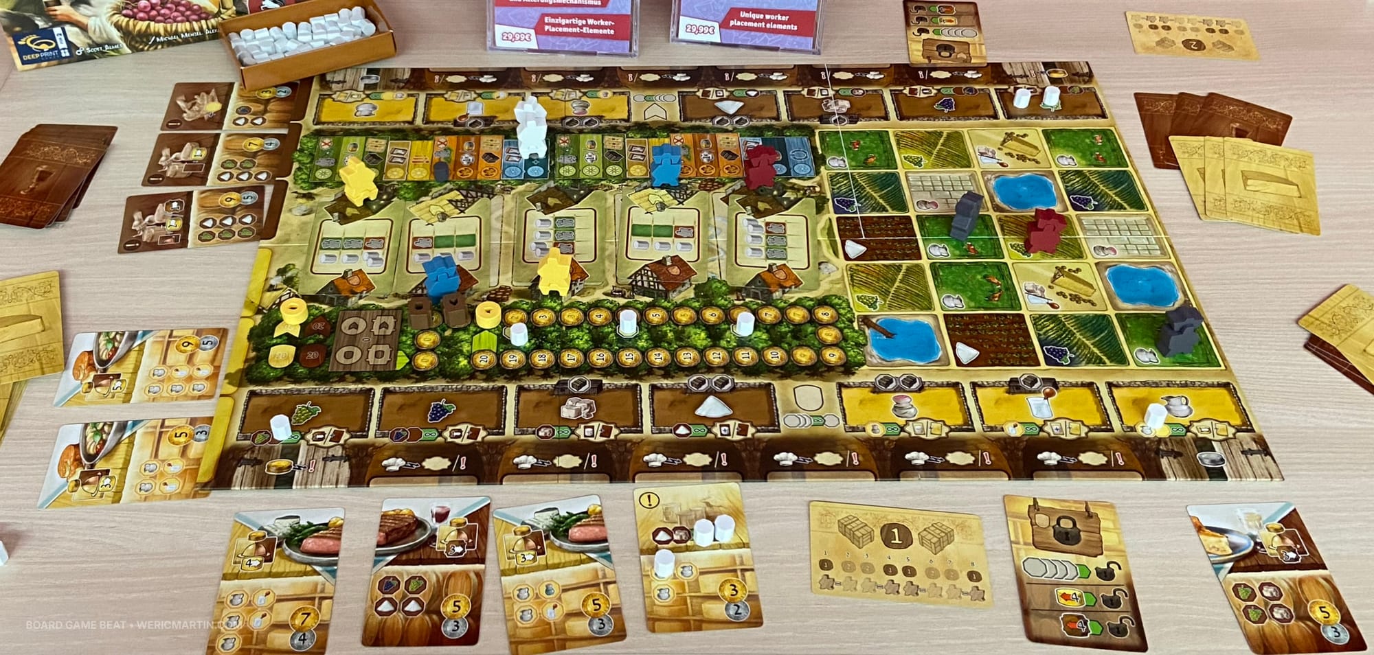 Display of the game board and components in Wine & Cheese