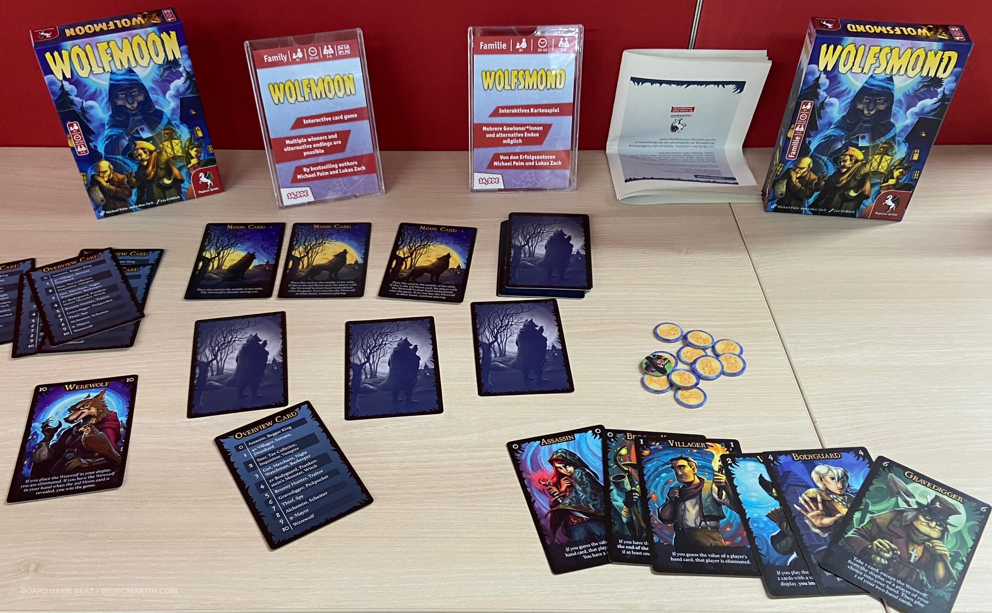 Boxes for Wolfmoon and Wolfsmond, with moon cards and sample character cards on display